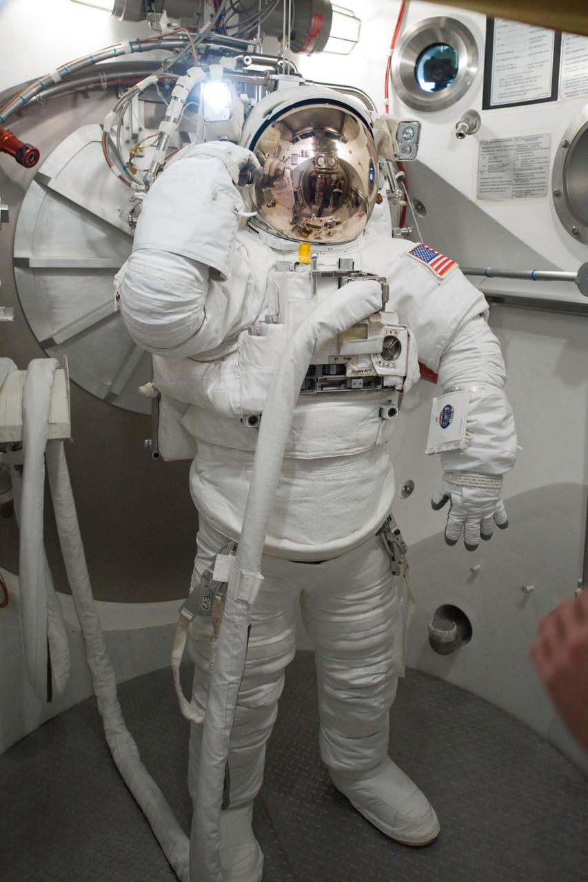 JSC2010-E-060734 (29 April 2010) --- NASA astronaut Greg Chamitoff, STS-134 mission specialist, participates in an Extravehicular Mobility Unit (EMU) spacesuit fit check in the Space Station Airlock Test Article (SSATA) in the Crew Systems Laboratory at NASA's Johnson Space Center.