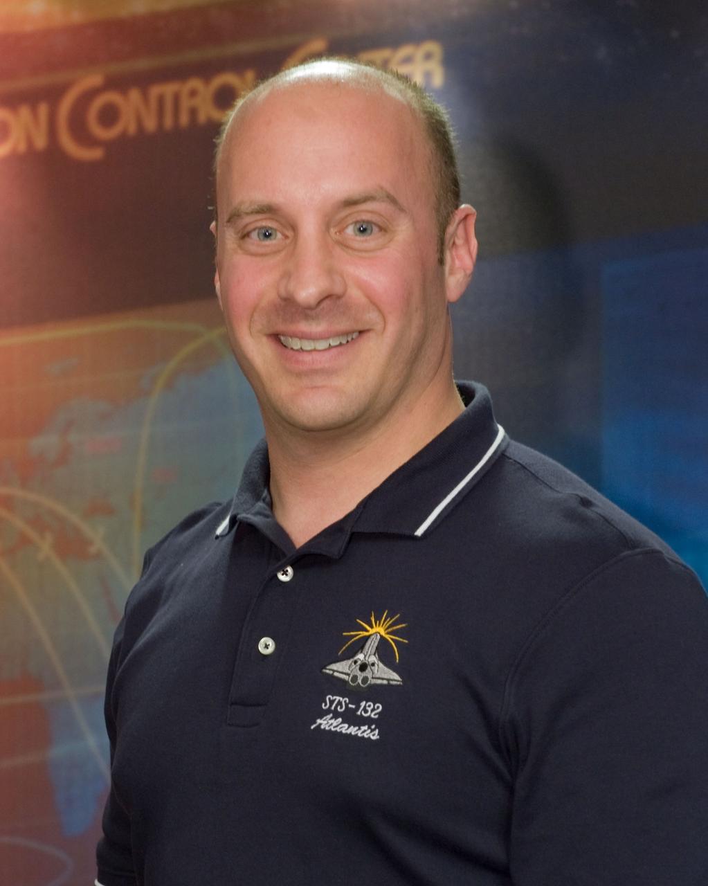 JSC2010-E-063821 (3 May 2010) --- NASA astronaut Garrett Reisman, STS-132 mission specialist, poses for a portrait following an STS-132 preflight press conference at NASA's Johnson Space Center.