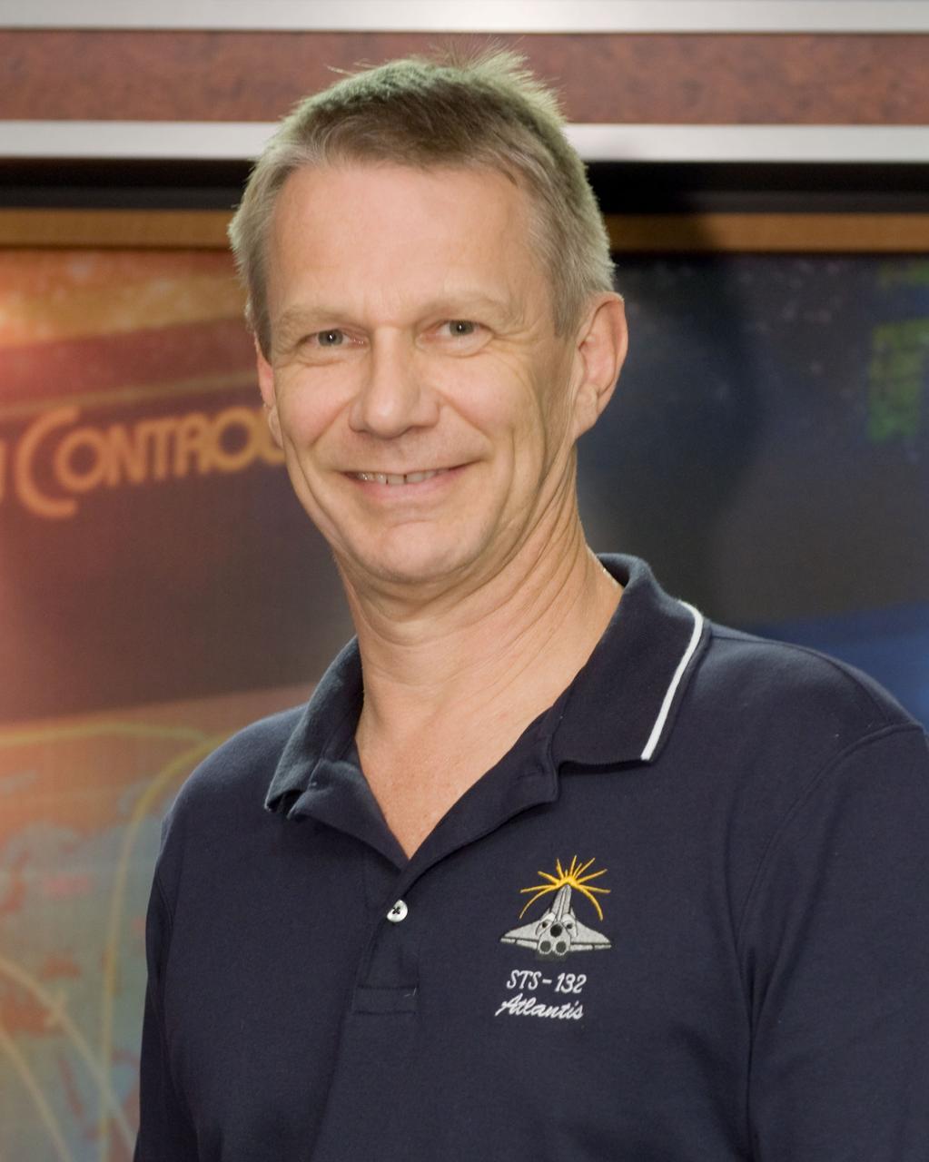 JSC2010-E-063826 (3 May 2010) --- NASA astronaut Piers Sellers, STS-132 mission specialist, poses for a portrait following an STS-132 preflight press conference at NASA's Johnson Space Center.