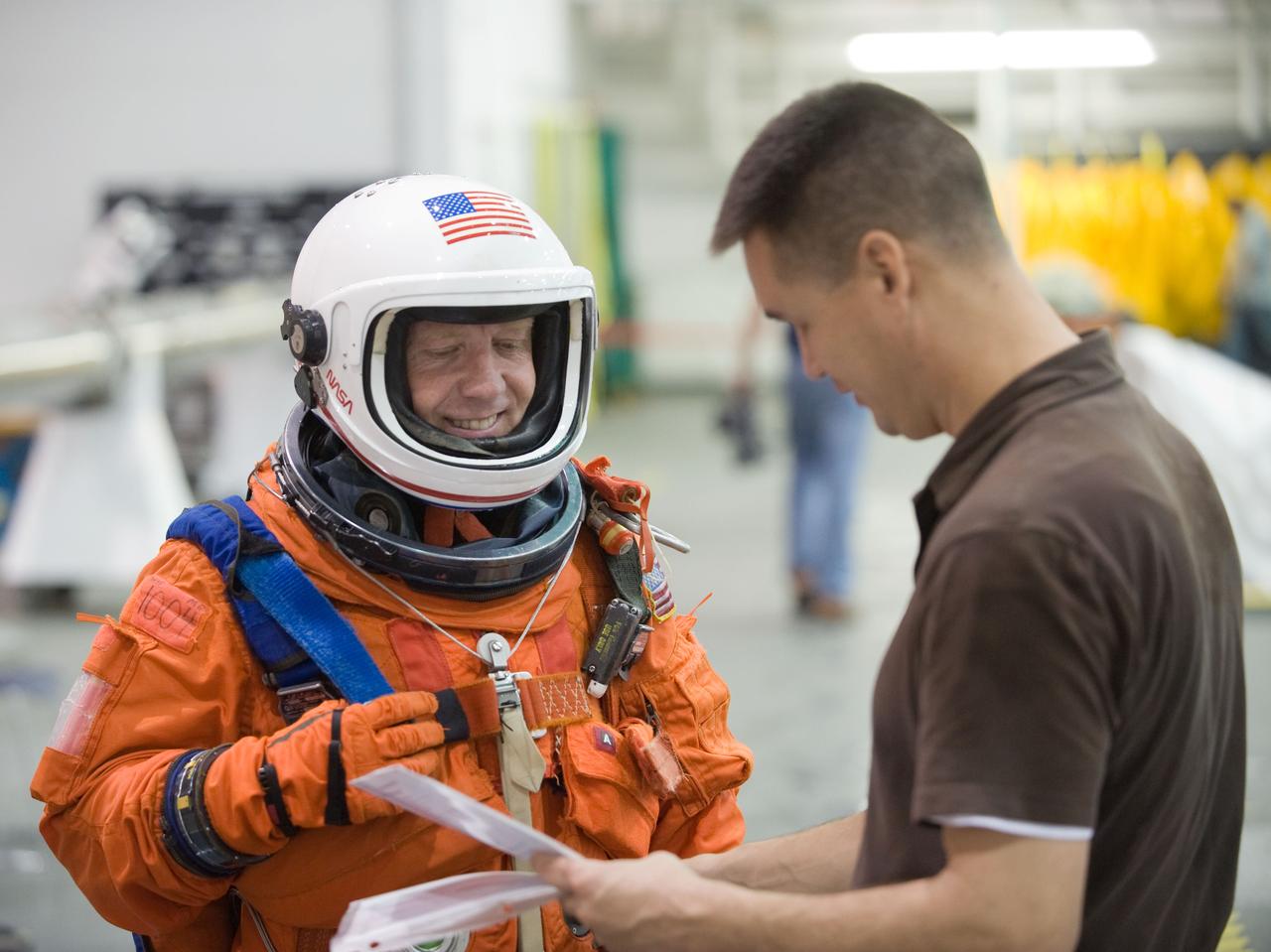 JSC2010-E-075082 (7 May 2010) --- NASA astronaut Steve Lindsey, STS-133 commander, attired in a training version of his shuttle launch and entry suit, participates in a training session in the Neutral Buoyancy Laboratory (NBL) near NASA's Johnson Space Center. Crew trainer Adam Flagan assisted Lindsey.