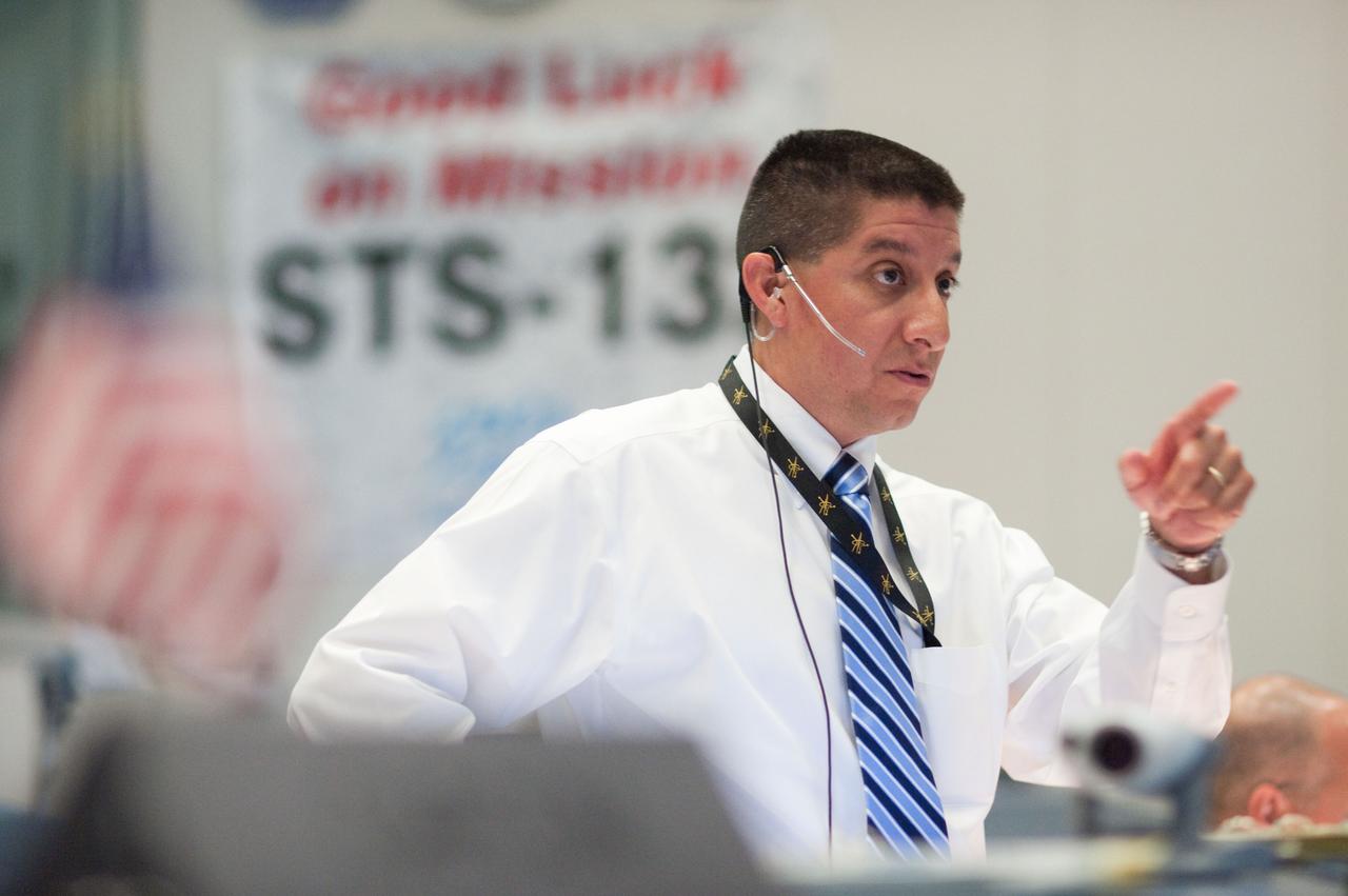 JSC2010-E-080444 (14 May 2010) --- Flight director Richard Jones is pictured in the space shuttle flight control room in the Mission Control Center at NASA's Johnson Space Center during launch countdown activities a few hundred miles away in Florida, site of space shuttle Atlantis? STS-132 launch. Liftoff was on time at 2:20 p.m. (EDT) on May 14, 2010 from launch pad 39A at NASA's Kennedy Space Center.