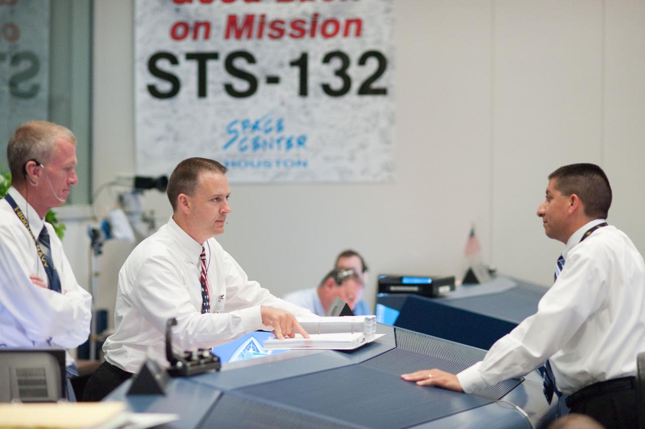 JSC2010-E-080446 (14 May 2010) --- Brent Jett (left), director, flight crew operations; along with flight directors Norm Knight (center) and Richard Jones are pictured in the space shuttle flight control room in the Mission Control Center at NASA's Johnson Space Center during launch countdown activities a few hundred miles away in Florida, site of space shuttle Atlantis' scheduled STS-132 launch. Liftoff was on time at 2:20 p.m. (EDT) on May 14, 2010 from launch pad 39A at NASA's Kennedy Space Center.