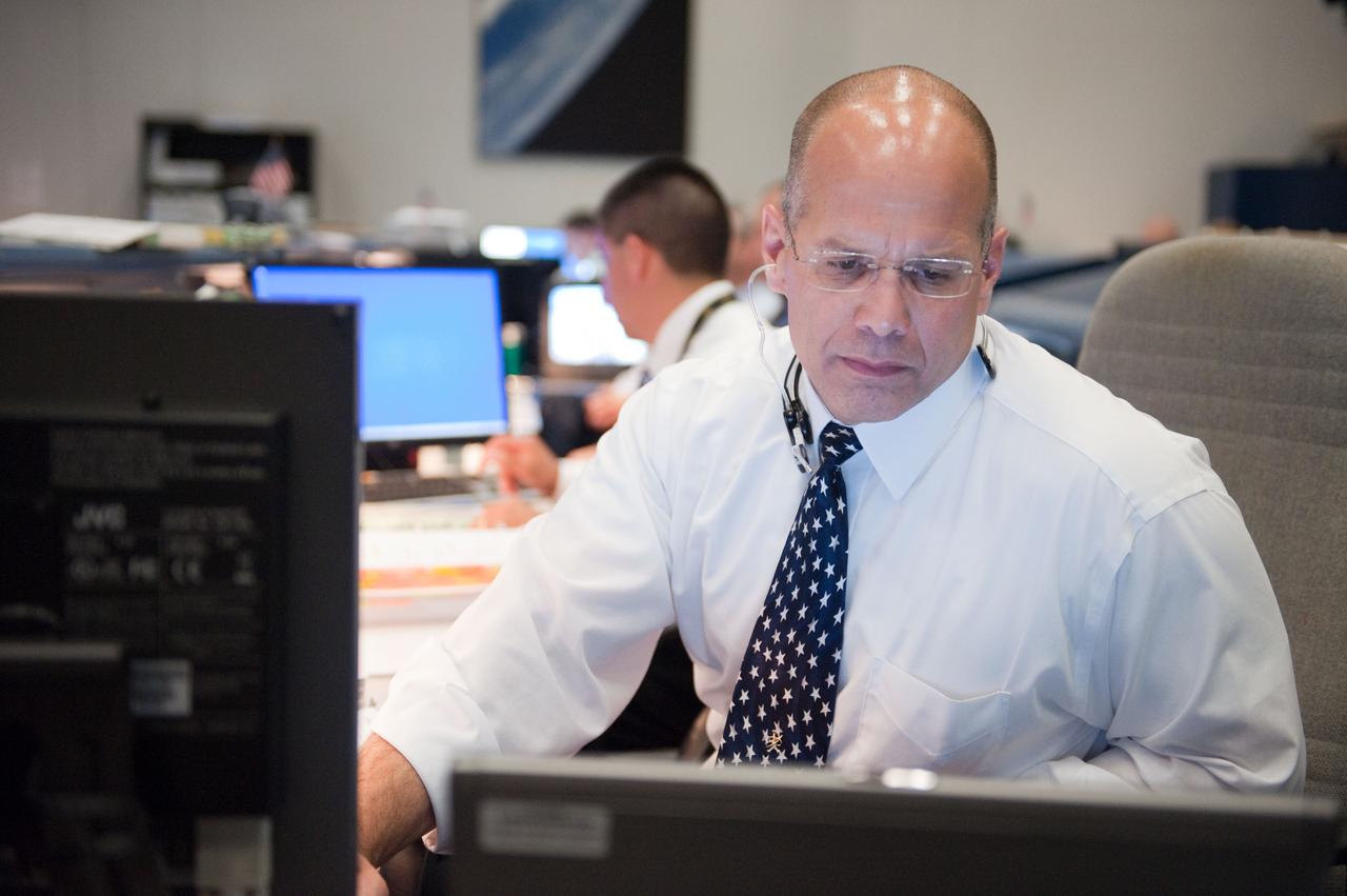 JSC2010-E-080454 (14 May 2010) --- Flight director Tony Ceccacci is pictured at his console in the space shuttle flight control room in the Mission Control Center at NASA's Johnson Space Center during launch countdown activities a few hundred miles away in Florida, site of space shuttle Atlantis? STS-132 launch. Liftoff was on time at 2:20 p.m. (EDT) on May 14, 2010 from launch pad 39A at NASA's Kennedy Space Center.