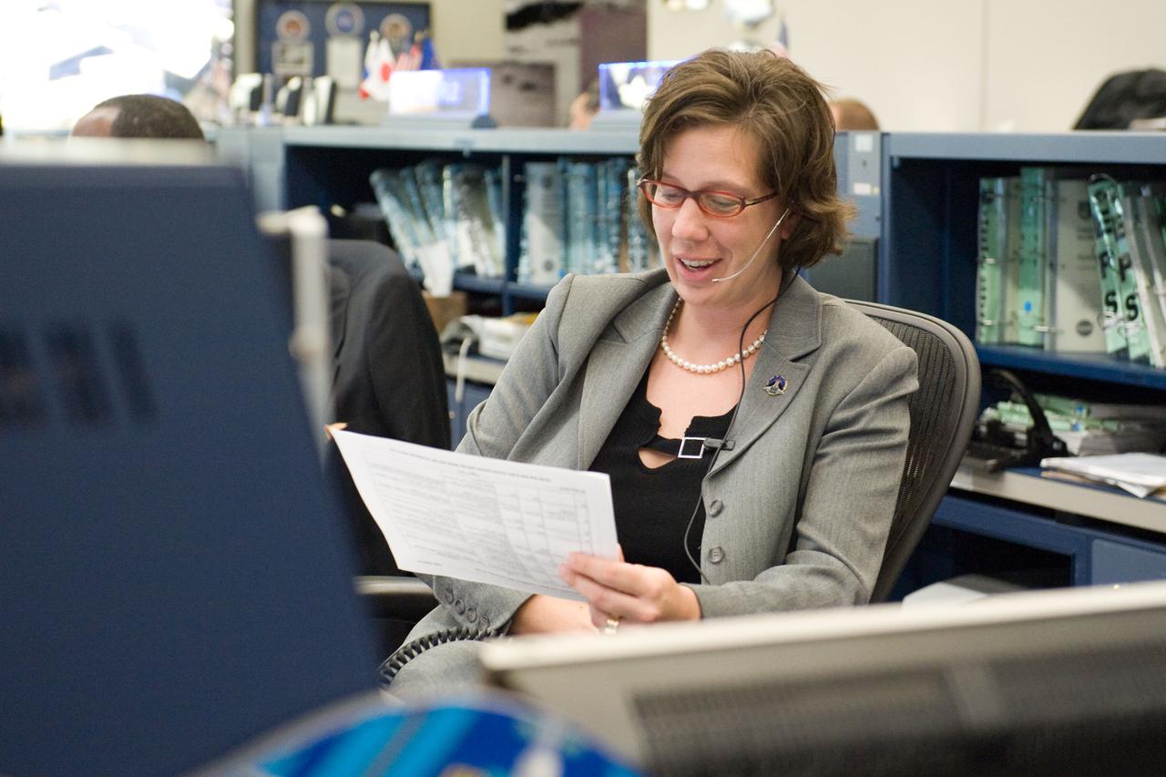 JSC2010-E-081914 (18 May 2010) --- ISS flight director Holly Ridings reviews data at her console in the space station flight control room in the Mission Control Center at NASA's Johnson Space Center during STS-132/ULF-4 mission flight day five activities.