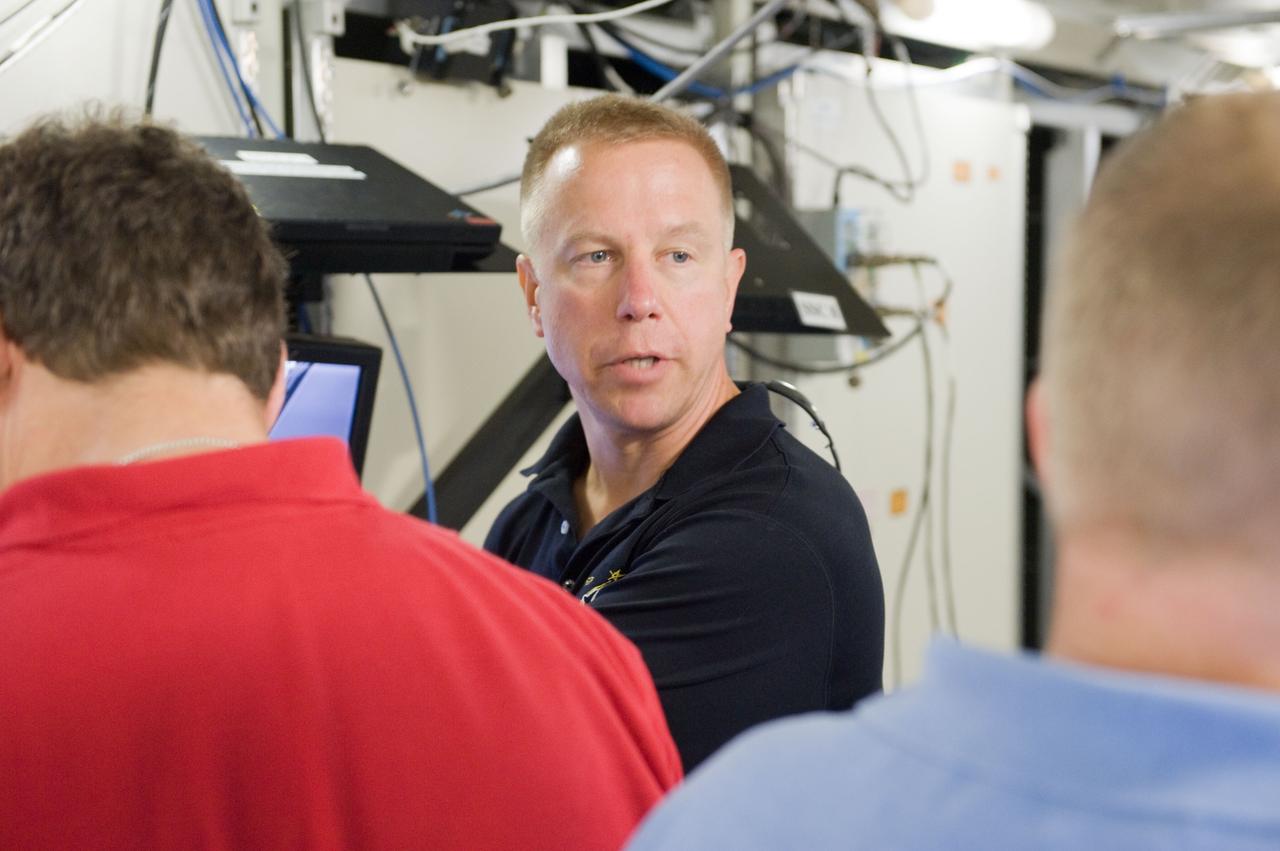 JSC2010-E-084027 (18 May 2010) --- NASA astronaut Tim Kopra, STS-133 mission specialist, is pictured during a robotics training session in the Jake Garn Simulation and Training Facility at NASA's Johnson Space Center.