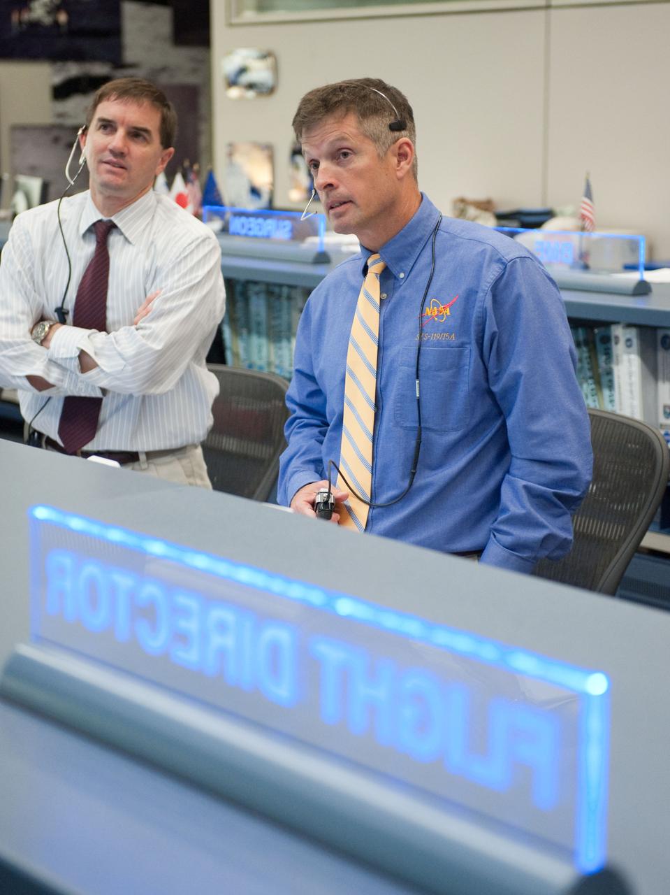 JSC2010-E-084214 (17 May 2010) --- NASA astronauts Rex Walheim (left) and Steve Swanson, spacecraft communicators (CAPCOM) for the STS-132 mission, are pictured in the space station flight control room in the Mission Control Center at NASA's Johnson Space Center during flight day four activities.