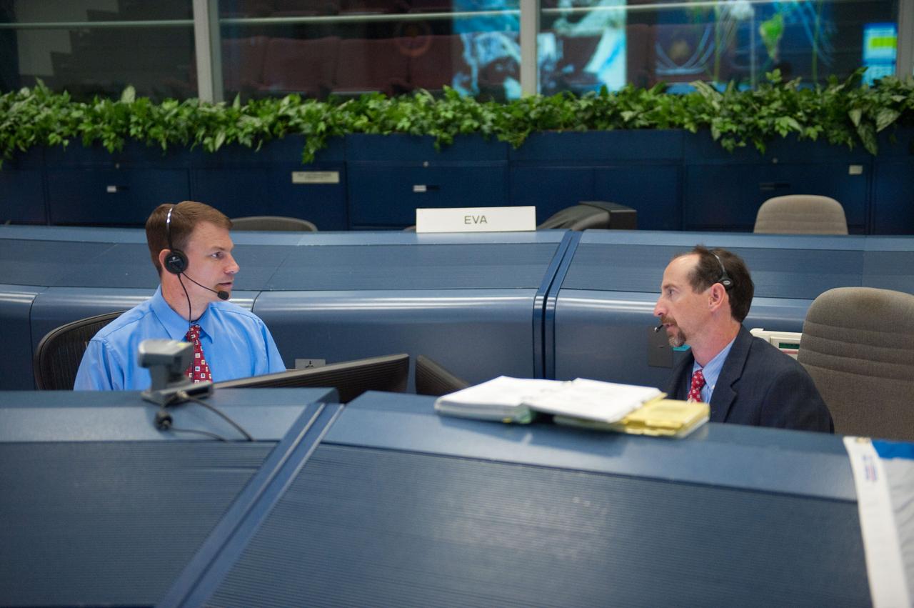 JSC2010-E-084271 (17 May 2010) --- Flight director Chris Edelen (right) and NASA astronaut Stanley Love, spacecraft communicator (CAPCOM) for the STS-132 mission, are pictured at their consoles in the space shuttle flight control room in the Mission Control Center at NASA's Johnson Space Center during flight day four activities.