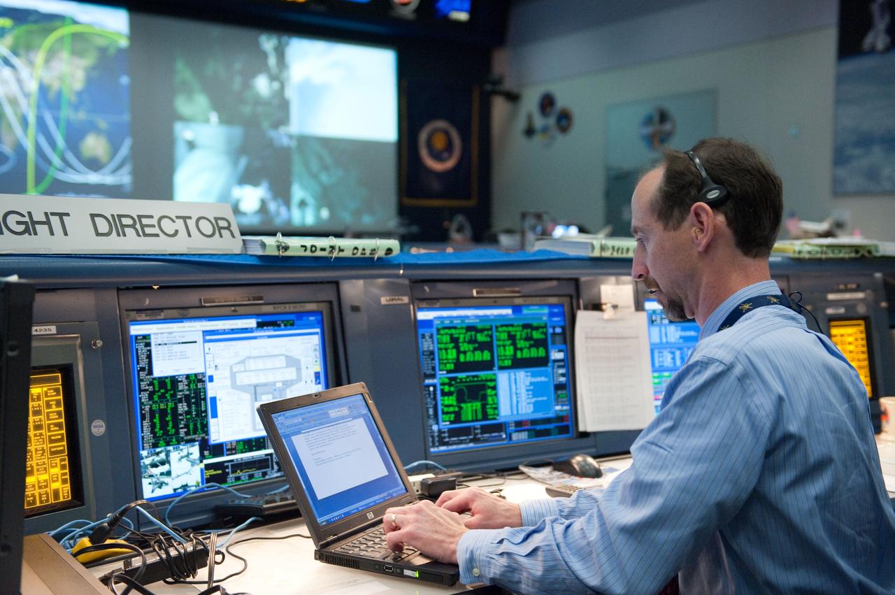 JSC2010-E-084363 (17 May 2010) --- Flight director Chris Edelen monitors data at his console in the space shuttle flight control room in the Mission Control Center at NASA's Johnson Space Center during STS-132 flight day four activities.