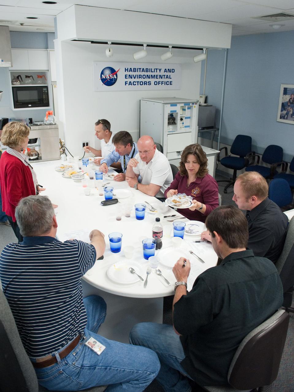 JSC2010-E-087710 (25 May 2010) --- STS-134 crew members and dieticians are pictured during a food tasting session in the Habitability and Environmental Factors Office at NASA's Johnson Space Center. Crew members pictured counter-clockwise (from bottom left) are NASA astronauts Gregory H. Johnson, pilot; Greg Chamitoff and Michael Fincke, both mission specialists; Mark Kelly, commander; European Space Agency astronaut Roberto Vittori and NASA astronaut Andrew Feustel, both mission specialists. Photo credit: NASA or National Aeronautics and Space Administration