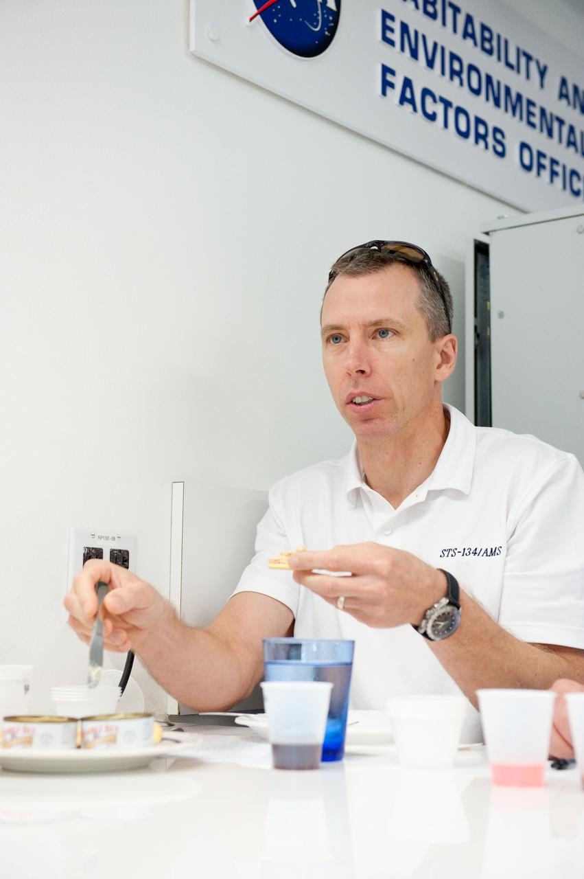 JSC2010-E-087712 (25 May 2010) --- NASA astronaut Andrew Feustel, STS-134 mission specialist, participates in a food tasting session in the Habitability and Environmental Factors Office at NASA's Johnson Space Center. Photo credit: NASA or National Aeronautics and Space Administration