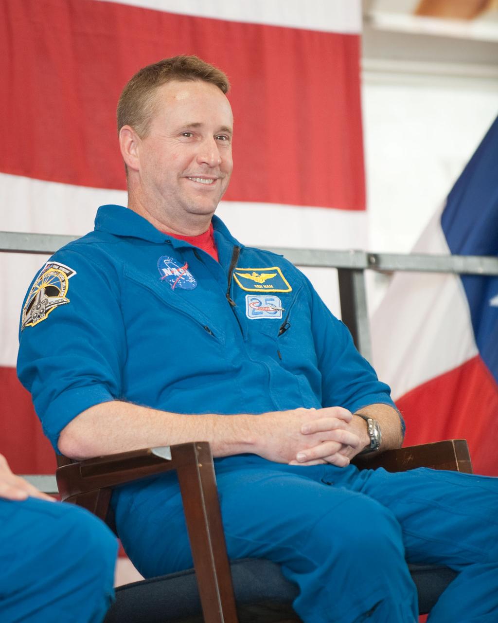 JSC2010-E-089683 (27 May 2010) ---  At Ellington Field's Hangar 276, NASA astronaut Ken Jam,  STS-132 mission commander, waits to speak to a large crowd of visitors at the crew return ceremony for space shuttle Atlantis' final scheduled mission. Each of the six crew members had a chance to express his sentiments to the visitors.  Photo credit: NASA or National Aeronautics and Space Administration