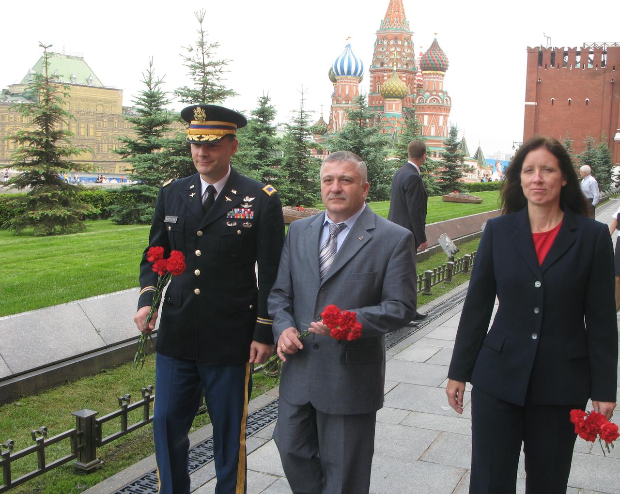 The prime crew for the launch of the Soyuz TMA-19 spacecraft to the International Space Station conducts its ceremonial tour of Red Square May 31, 2010 prior to flying to the Baikonur Cosmodrome in Kazakhstan for final prelaunch preparations. From left to right are prime crewmembers Doug Wheelock, Soyuz Commander Fyodor Yurchikhin and Flight Engineer Shannon Walker.  They are scheduled to liftoff June 16 to the International Space Station.  Credit: NASA/Stephanie Stoll and Mark Polansky 