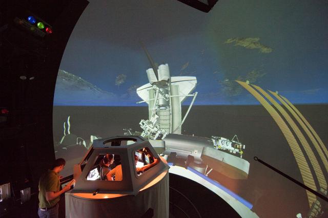 NASA image: STS-133 crew members Mike Barratt and Nicole Stott in cupola