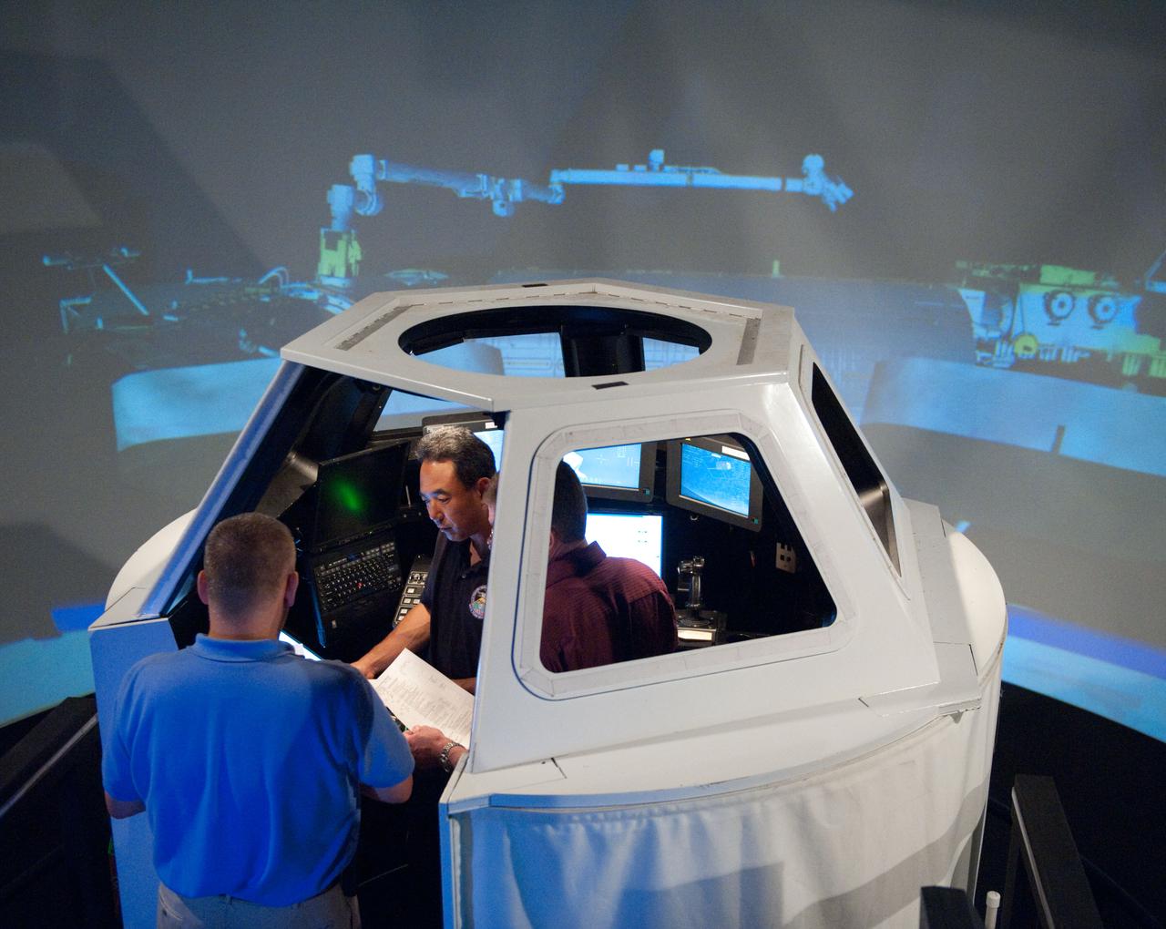PHOTO DATE: 06-29-10 LOCATION: BLDG 16 - SES DOME SUBJECT:  Satoshi Furukawa during FF RNDZ ADV1 training in the ISS cupola trainer in the SES dome. Since DOME/SESC has new training equipment to train robotics operation WORK ORDER:   01943-BS-JAXASES-06-29-10  PHOTOGRAPHER: BILL STAFFORD