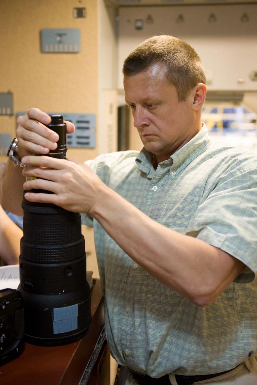 PHOTO DATE: 07-13-10 LOCATION: Bldg 9NW, ISS Mockups SUBJECT: Expedition 26 crew members Cady Coleman and Dmitri Kondratyev during their docking timeline training. PHOTOGRAPHER: James Blair