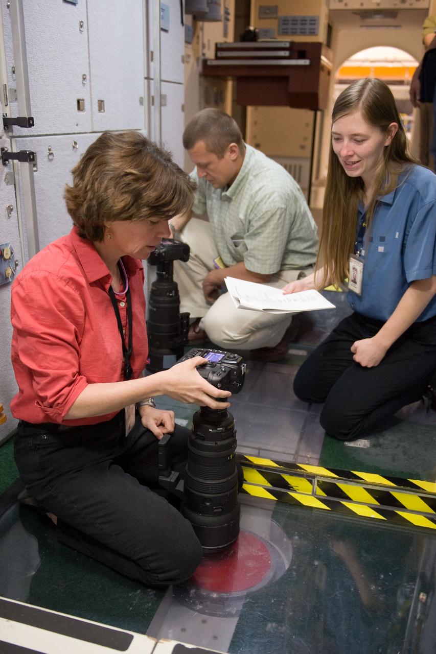 PHOTO DATE: 07-13-10 LOCATION: Bldg 9NW, ISS Mockups SUBJECT: Expedition 26 crew members Cady Coleman and Dmitri Kondratyev during their docking timeline training. PHOTOGRAPHER: James Blair