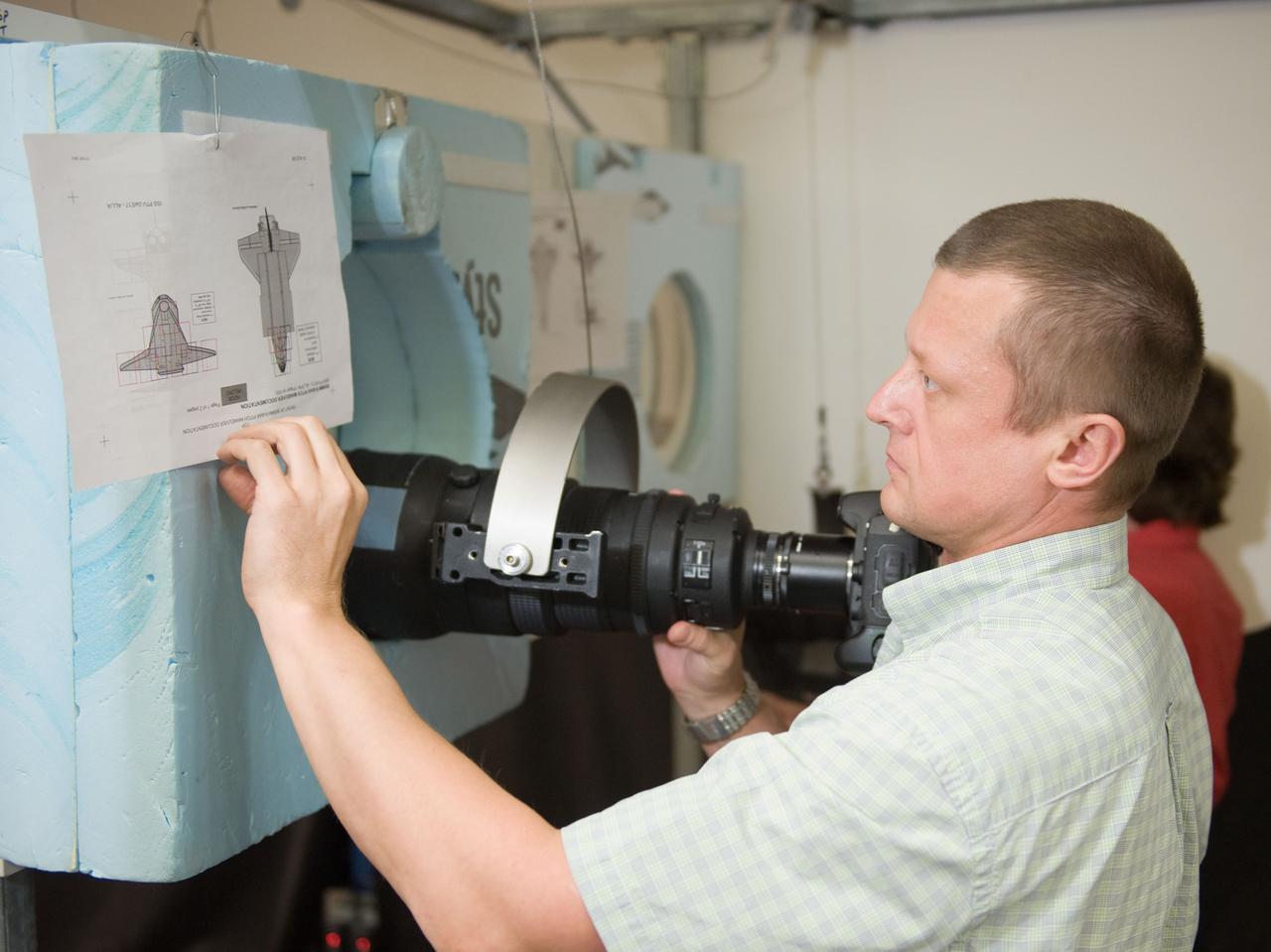 PHOTO DATE: 07-13-10 LOCATION: Bldg 9NW, ISS Mockups SUBJECT: Expedition 26 crew members Cady Coleman and Dmitri Kondratyev during their docking timeline training. PHOTOGRAPHER: James Blair