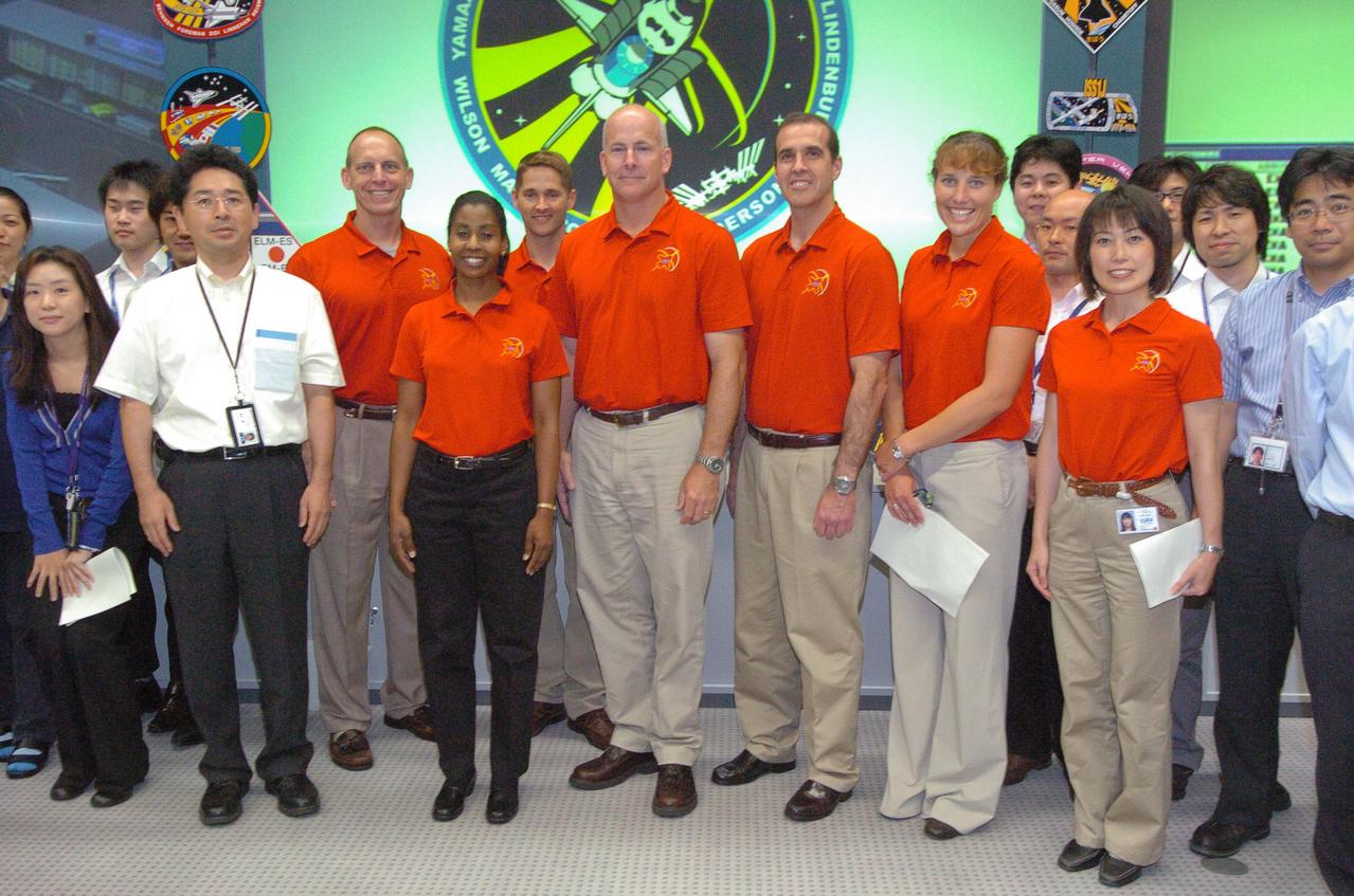 JSC2010-E-108818 (29 June 2010) --- The STS-131 crew is pictured with part of the support team at the Space Station Integration and Promotion Center in the Tsukuba Space Center on June 29 during one of its trips following the mission. Pictured in red shirts from the left are NASA astronauts  Clayton Anderson,   Stephanie Wilson, James P. Dutton Jr . Alan Poindexter,  Rick Mastracchio and  Dorothy Metcalf-Lindenburger, along with Japan Aerospace Exploration Agency (JAXA) astronaut Naoko Yamazaki.   Photo credit: Japan Aerospace Exploration Agency or JAXA