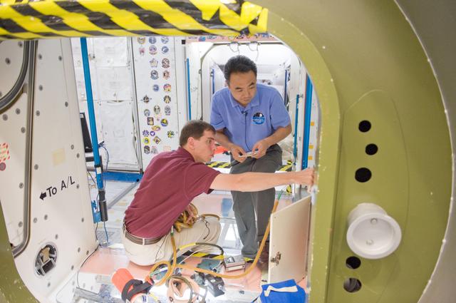 NASA image: ISS 28 crew member Mike Fossum, Satoshi Furukawa, Sergei Volkov  