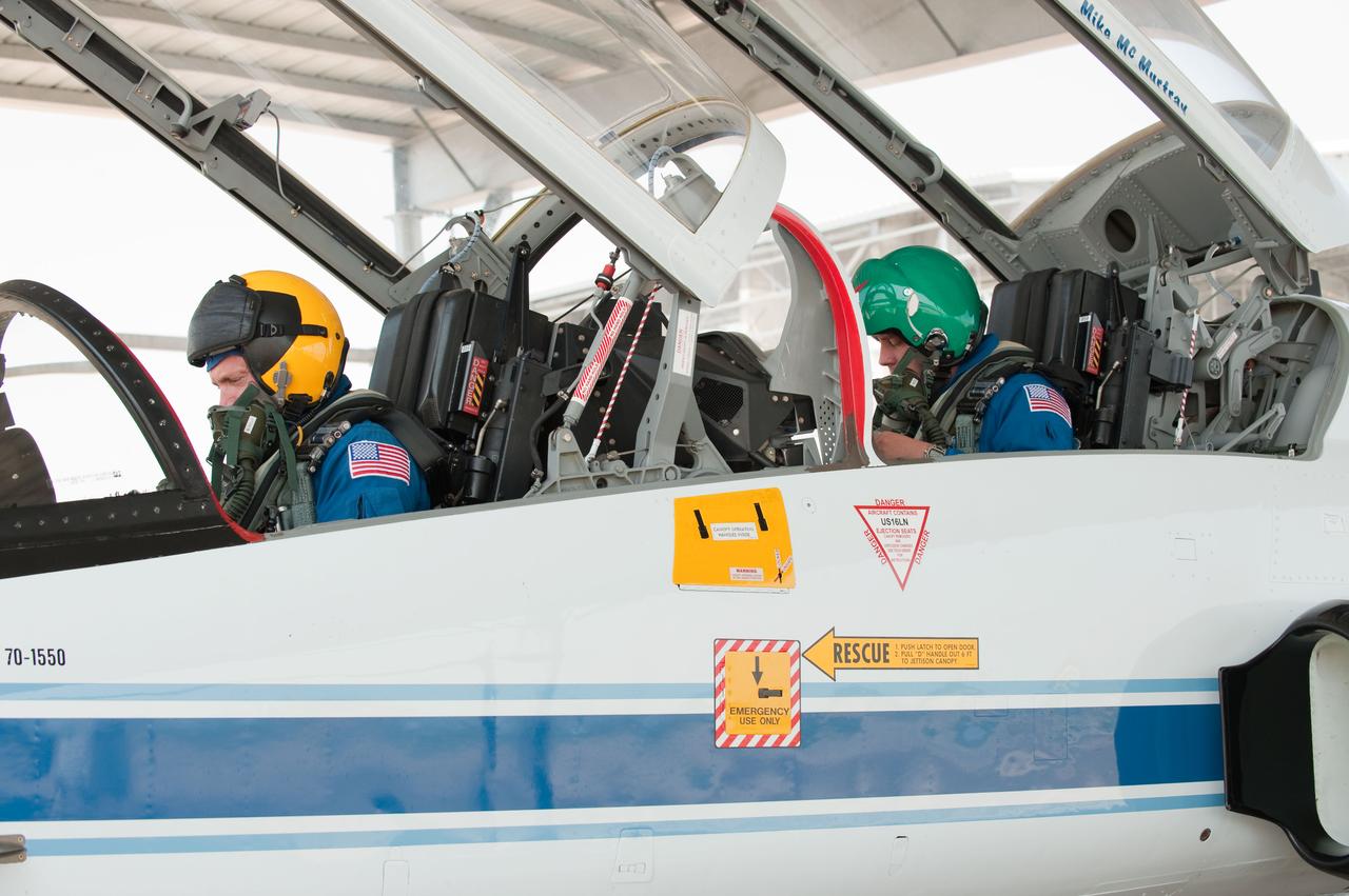 JSC2010-E-119552 (25 Aug. 2010) --- NASA astronauts Mark Kelly (left), STS-134 commander; and Michael Fincke, mission specialist, prepare for a flight in a NASA T-38 trainer jet at Ellington Field near NASA's Johnson Space Center. Photo credit: NASA or National Aeronautics and Space Administration