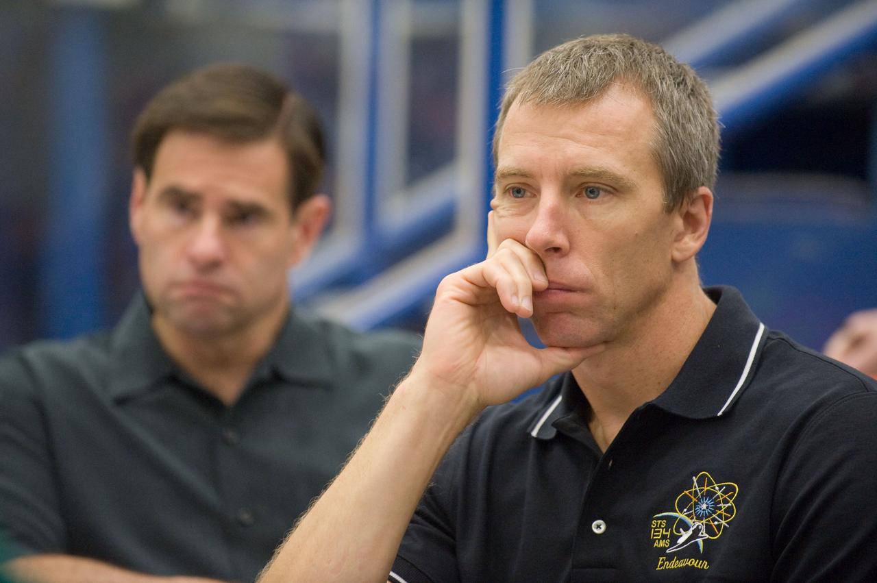 JSC2010-E-132395 (16 July 2010) --- NASA astronauts Andrew Feustel (foreground) and Greg Chamitoff, both STS-134 mission specialists, are pictured during an emergency scenarios training session in the Space Vehicle Mockup Facility at NASA's Johnson Space Center. Photo credit: NASA or National Aeronautics and Space Administration