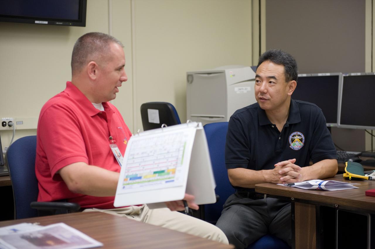 Expedition 28 JAXA Astronaut Satoshi Furukawa and Astronaut Mike Fossum during FF RNDZ ADV 4 training.  Training includes HTV rendezvous operation.  Photo Date: September 15, 2010.  Location: Building 30 - SIM City.  Photographer: Robert Markowitz.