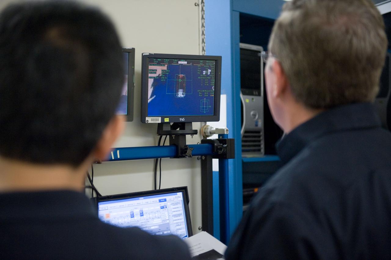 Expedition 28 JAXA Astronaut Satoshi Furukawa and Astronaut Mike Fossum during FF RNDZ ADV 4 training.  Training includes HTV rendezvous operation.  Photo Date: September 15, 2010.  Location: Building 30 - SIM City.  Photographer: Robert Markowitz.