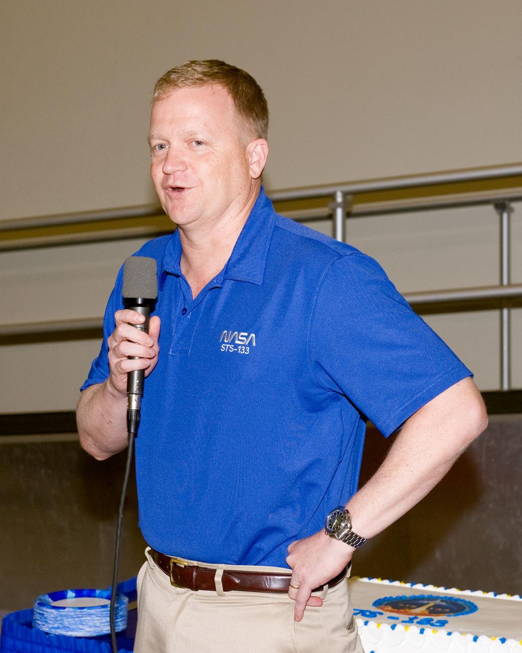 JSC2010-E-164856 (20 Sept. 2010) --- NASA astronaut Eric Boe, STS-133 pilot, speaks to a crowd during a cake-cutting ceremony in the Jake Garn Simulation and Training Facility at NASA's Johnson Space Center. Photo credit: NASA or National Aeronautics and Space Administration