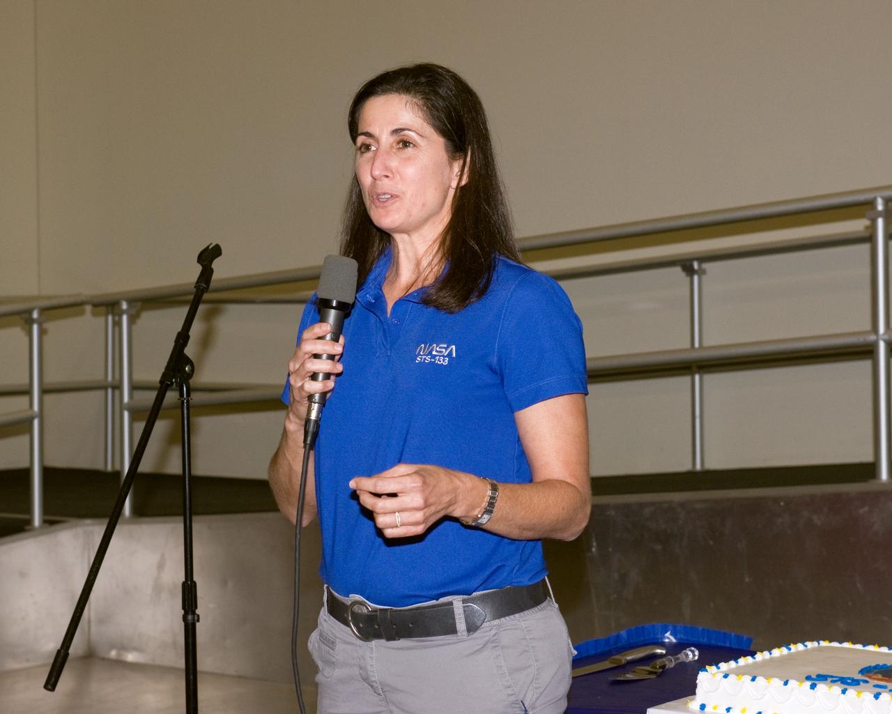 JSC2010-E-164859 (20 Sept. 2010) --- NASA astronaut Nicole Stott, STS-133 mission specialist, speaks to a crowd during a cake-cutting ceremony in the Jake Garn Simulation and Training Facility at NASA's Johnson Space Center. Photo credit: NASA or National Aeronautics and Space Administration