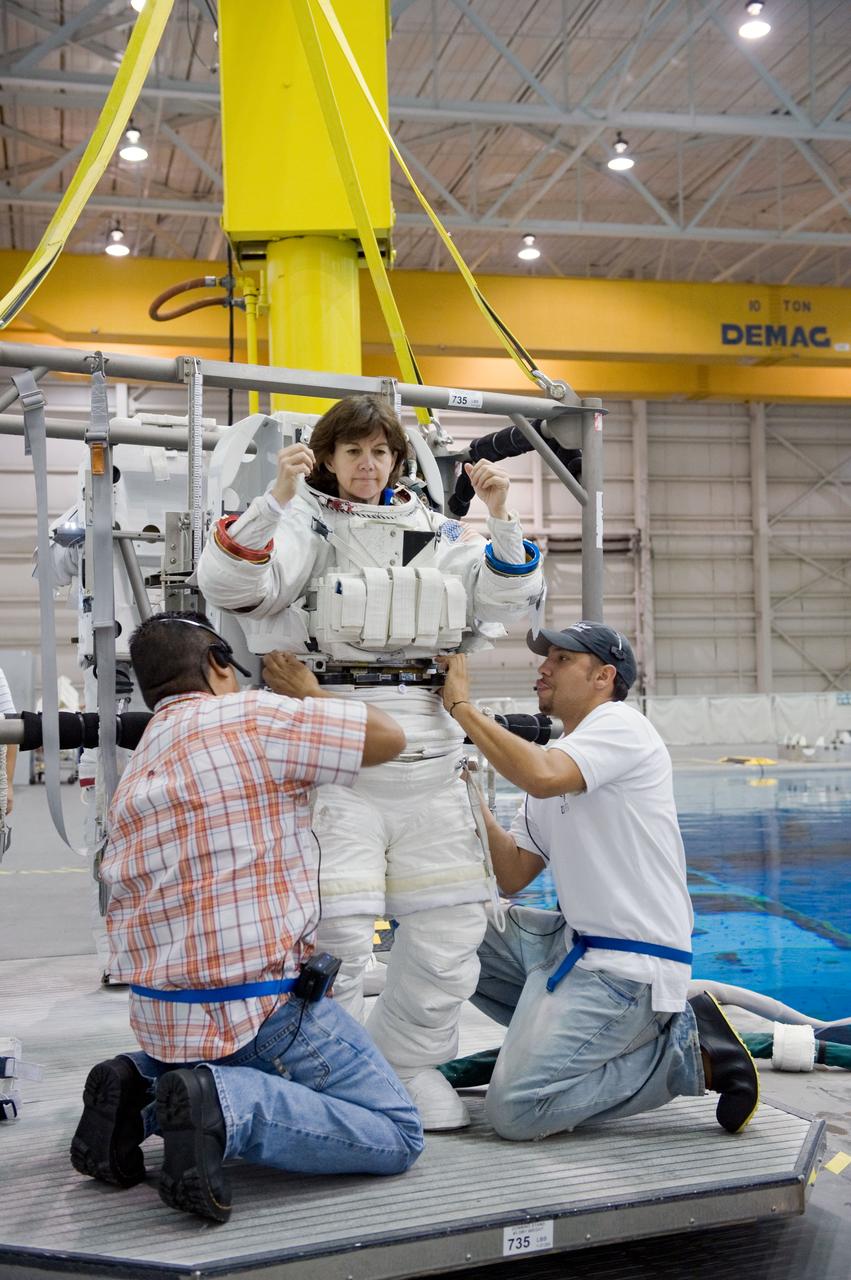 Expedition 26 crew members Cady Coleman and Paolo Nespoli during ISS EVA PRF 41027 training in the NBL. Photo Date: September 21, 2010. Location: NBL - Pool Topside. Photographer: Robert Markowitz.
