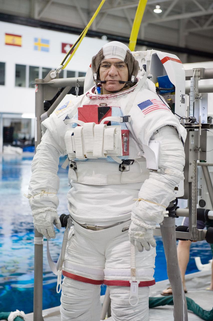 Expedition 26 crew members Cady Coleman and Paolo Nespoli during ISS EVA PRF 41027 training in the NBL. Photo Date: September 21, 2010. Location: NBL - Pool Topside. Photographer: Robert Markowitz.