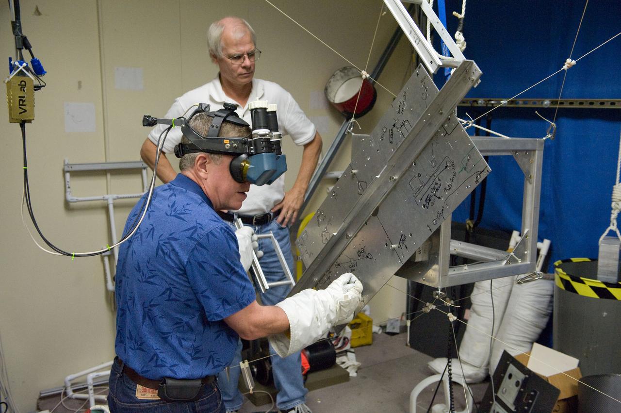  PHOTO DATE: 23 September 2010, LOCATION: Bldg. 9 Virtual Reality Lab, SUBJECT: Expedition 28 crew members Mike Fossum and Satoshi Furukawa during ROBO/EVA #1 Training. PHOTOGRAPHER: Mark Sowa