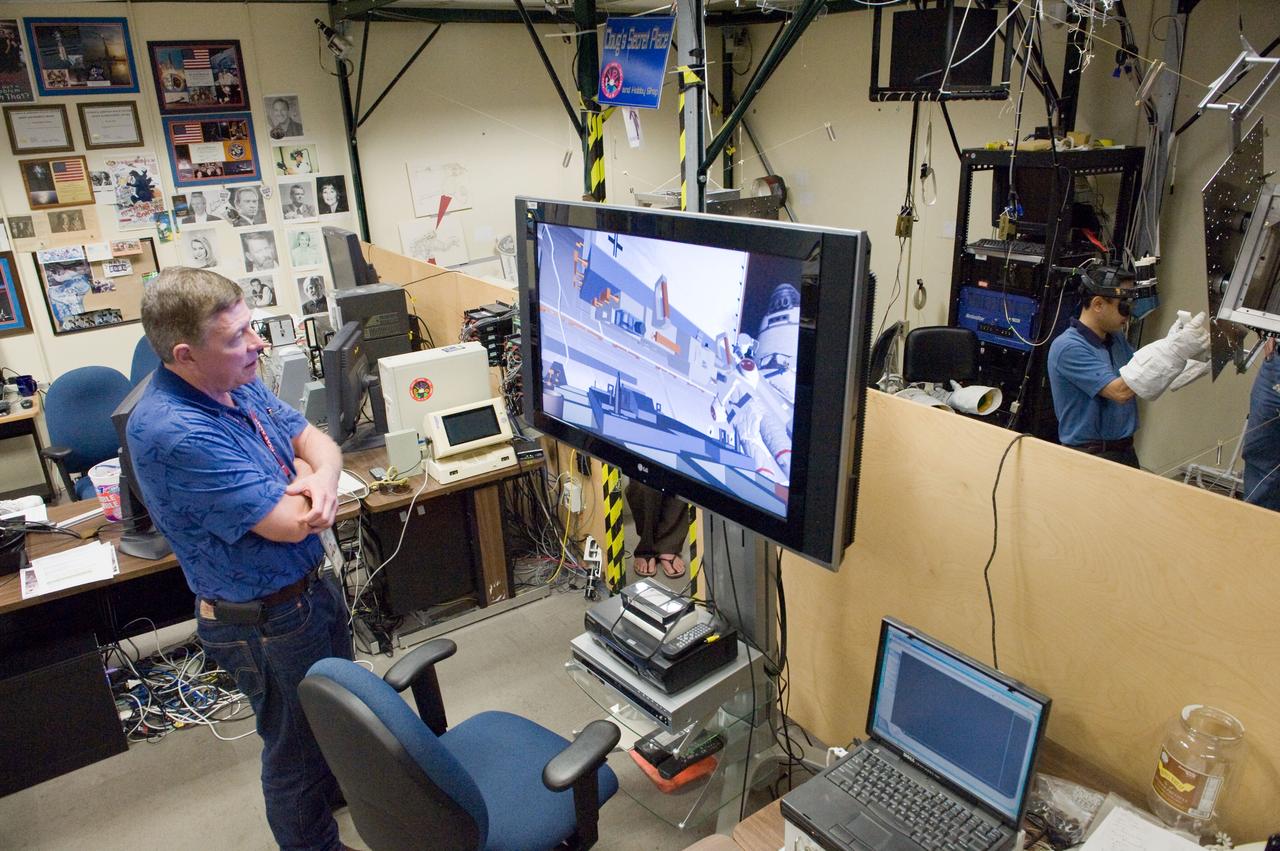  PHOTO DATE: 23 September 2010, LOCATION: Bldg. 9 Virtual Reality Lab, SUBJECT: Expedition 28 crew members Mike Fossum and Satoshi Furukawa during ROBO/EVA #1 Training. PHOTOGRAPHER: Mark Sowa