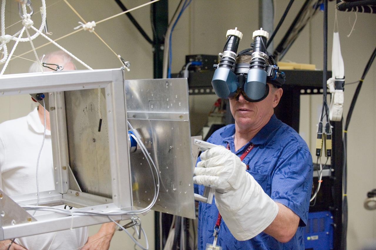PHOTO DATE: 23 September 2010, LOCATION: Bldg. 9 Virtual Reality Lab, SUBJECT: Expedition 28 crew members Mike Fossum and Satoshi Furukawa during ROBO/EVA #1 Training. PHOTOGRAPHER: Mark Sowa