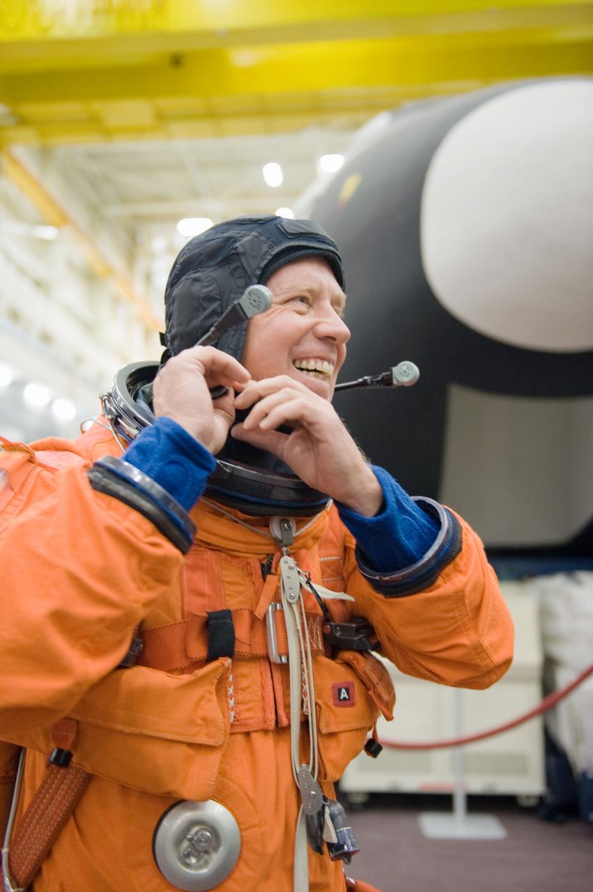 JSC2010-E-166824 (24 Sept. 2010) --- NASA astronaut Steve Lindsey, STS-133 commander, dons a training version of his shuttle launch and entry suit in preparation for a training session in the Space Vehicle Mock-up Facility at NASA's Johnson Space Center. Photo credit: NASA or National Aeronautics and Space Administration