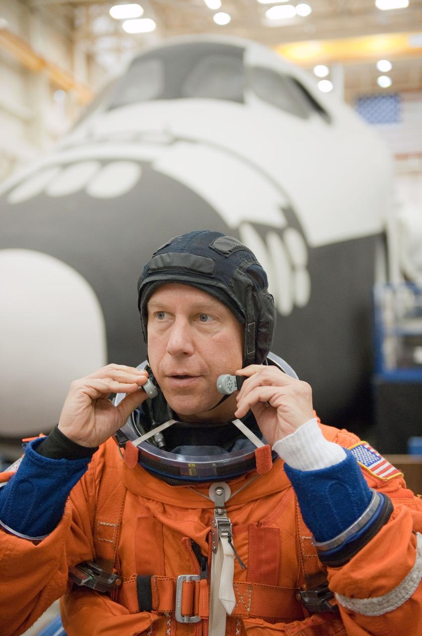 JSC2010-E-166831 (24 Sept. 2010) --- NASA astronaut Tim Kopra, STS-133 mission specialist, attired in a training version of his shuttle launch and entry suit, participates in a training session in the Space Vehicle Mock-up Facility at NASA's Johnson Space Center. Photo credit: NASA or National Aeronautics and Space Administration
