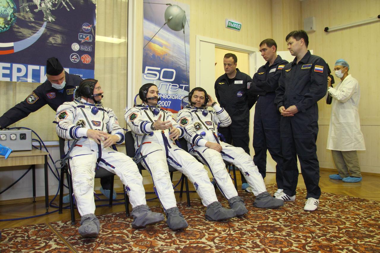At the Baikonur Cosmodrome in Kazakhstan, Expedition 25 Flight Engineers Scott Kelly of NASA, Alexander Kaleri and Oleg Skripochka (left to right) discuss the progress of their launch preparations September 26, 2010 with their backups, Ron Garan, Sergei Volkov and Oleg Kononenko (left to right) as they prepared to check out the Soyuz TMA-01M spacecraft they will launch in October 8 to the International Space Station.  Credit: NASA/Victor Zelentsov  