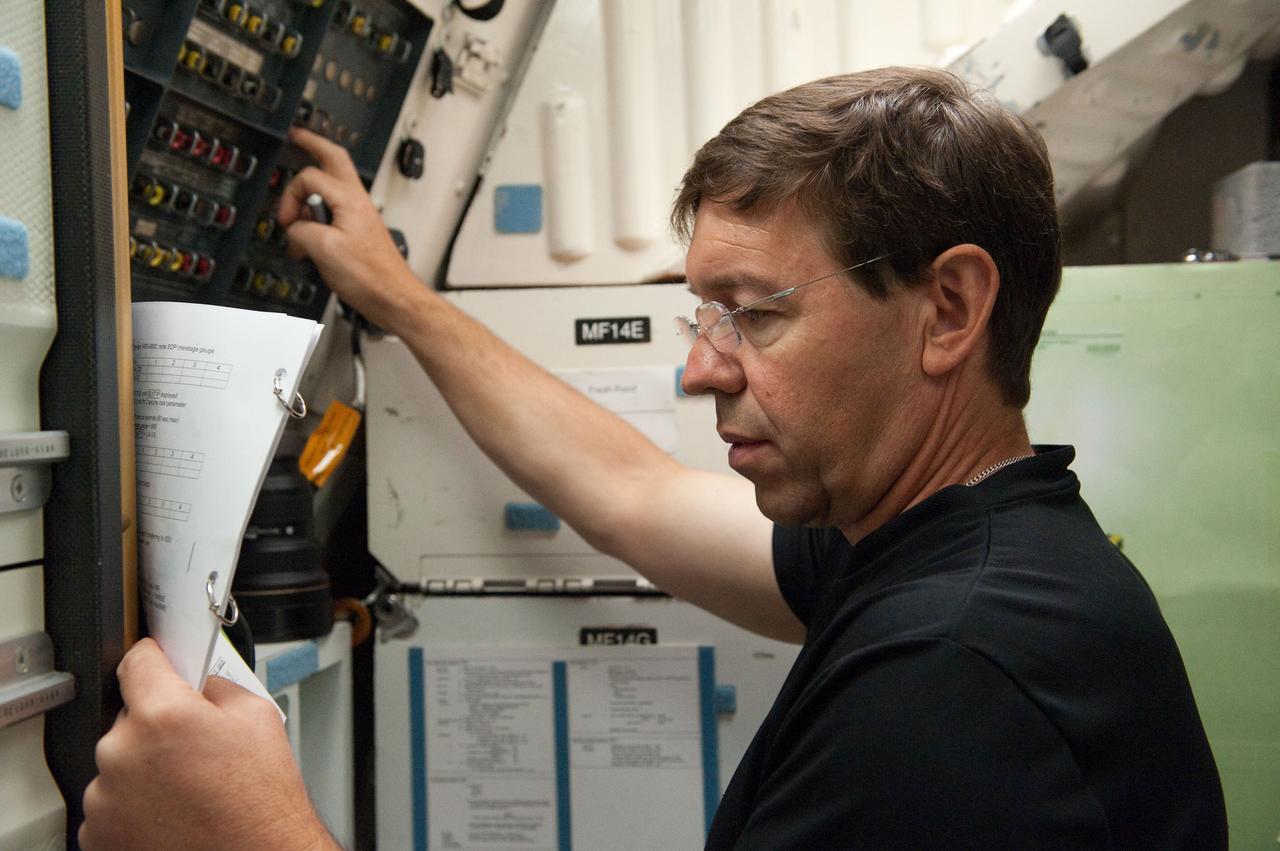 JSC2010-E-170398 (29 Sept. 2010) --- NASA astronaut Michael Barratt, STS-133 mission specialist, participates in a training session in an International Space Station mock-up/trainer in the Space Vehicle Mock-up Facility at NASA's Johnson Space Center. Photo credit: NASA or National Aeronautics and Space Administration
