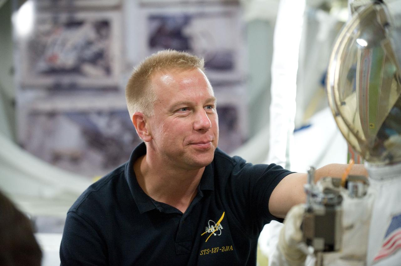 JSC2010-E-170408 (29 Sept. 2010) --- NASA astronaut Tim Kopra, STS-133 mission specialist, participates in a training session in an International Space Station mock-up/trainer in the Space Vehicle Mock-up Facility at NASA's Johnson Space Center. Photo credit: NASA or National Aeronautics and Space Administration