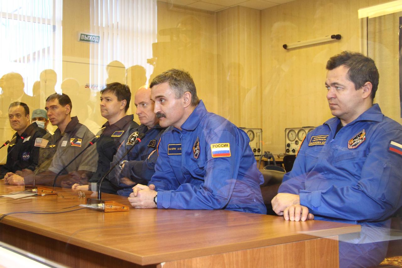 At the Baikonur Cosmodrome in Kazakhstan (from left to right), Expedition 25 backup crewmembers Ron Garan of NASA, Sergei Volkov and Oleg Kononenko and the prime crewmembers Scott Kelly, Alexander Kaleri and Oleg Skripochka discuss their training with Russian space officials October 3, 2010 following a final inspection of the Soyuz TMA-01M spacecraft that Kelly, Kaleri and Skripochka will launch in October 8 en route to the International Space Station.  Credit: NASA/Victor Zelentsov 