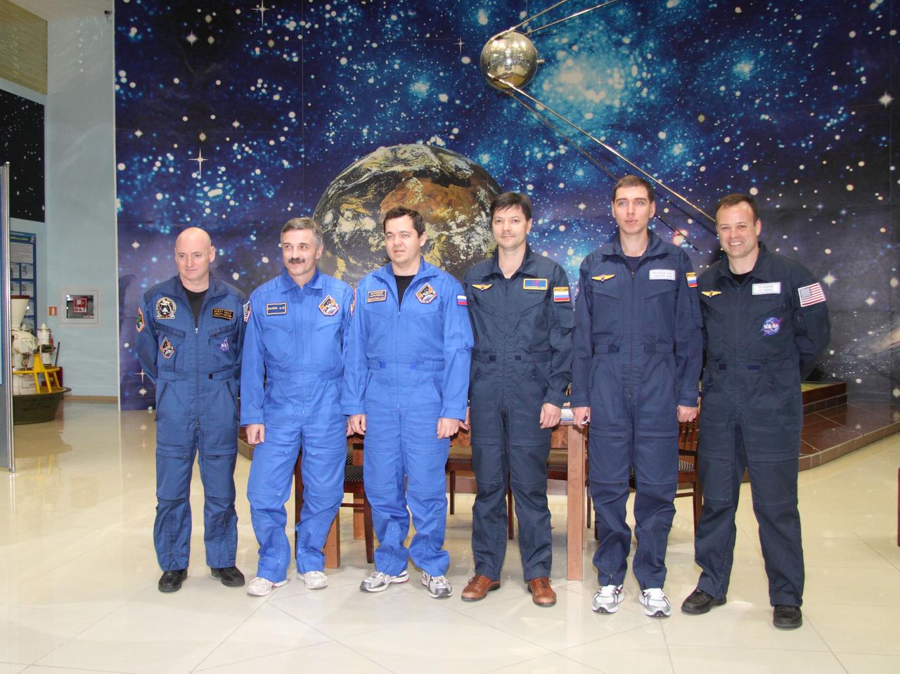 At the Baikonur Cosmodrome in Kazakhstan, the prime and backup crews for Expedition 25 pose for pictures at the Korolev Museum October 3, 2010 as Flight Engineers Scott Kelly, Alexander Kaleri and Oleg Skripochka prepare for launch in the Soyuz TMA-01M spacecraft October 8 en route to the International Space Station. Shown from left to right are Kelly, Kaleri, Skripochka and their backups, Oleg Kononenko, Sergei Volkov and Ron Garan.  Credit: NASA/Victor Zelentsov 