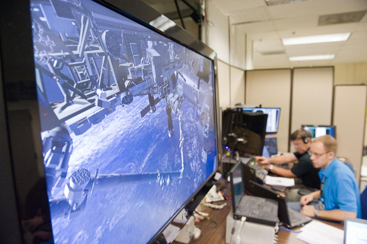 JSC2010-E-170877 (1 Oct. 2010) --- A large monitor is featured in this image during STS-133 crew members? training activities in the virtual reality laboratory in the Space Vehicle Mock-up Facility at NASA's Johnson Space Center. Photo credit: NASA or National Aeronautics and Space Administration