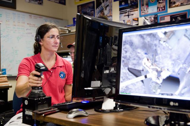 NASA image: STS-133 crew during MSS/EVAA TEAM training in Virtual Reality Lab  