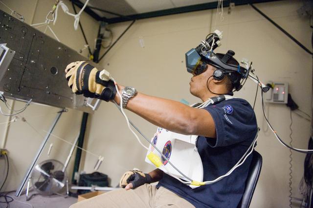 NASA image: STS-133 crew during MSS/EVAA TEAM training in Virtual Reality Lab  