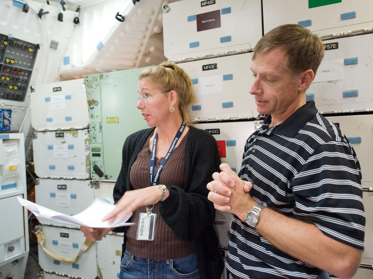 JSC2010-E-170907 (1 Oct. 2010) --- NASA astronauts Chris Ferguson, STS-135 commander; and Sandy Magnus, mission specialist, participate in a training session on the middeck of the crew compartment trainer (CCT-2) in the Space Vehicle Mock-up Facility at NASA's Johnson Space Center. STS-135 is planned to be the final mission of the space shuttle program. Photo credit: NASA or National Aeronautics and Space Administration