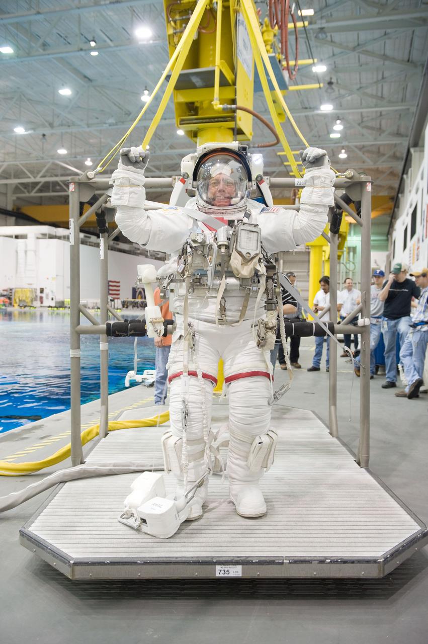 PHOTO DATE: 10-26-10 LOCATION:  NBL - Pool Topside SUBJECT:  Expedition 27 crew member Ron Garan and Expedition 28 crew member Mike Fossum during a joint INC-27/INC-28 ISS EVA Cleanup training session at the NBL WORK ORDER:   03126-BS__NBLEXP27_10-26-10  PHOTOGRAPHER:   BILL STAFFORD