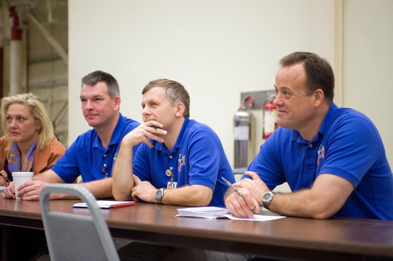 PHOTO DATE:  10-28-10 LOCATION:  Bldg 9NW, ISS Mockups SUBJECT:  Expedition 27 crew members Ron Garan, Andre Borisenko and Aleksandr Samokutyayev all working with instructors Nadine Lashier and Jennifer James during the crew's Routine Ops training PHOTOGRAPHER: James Blair 