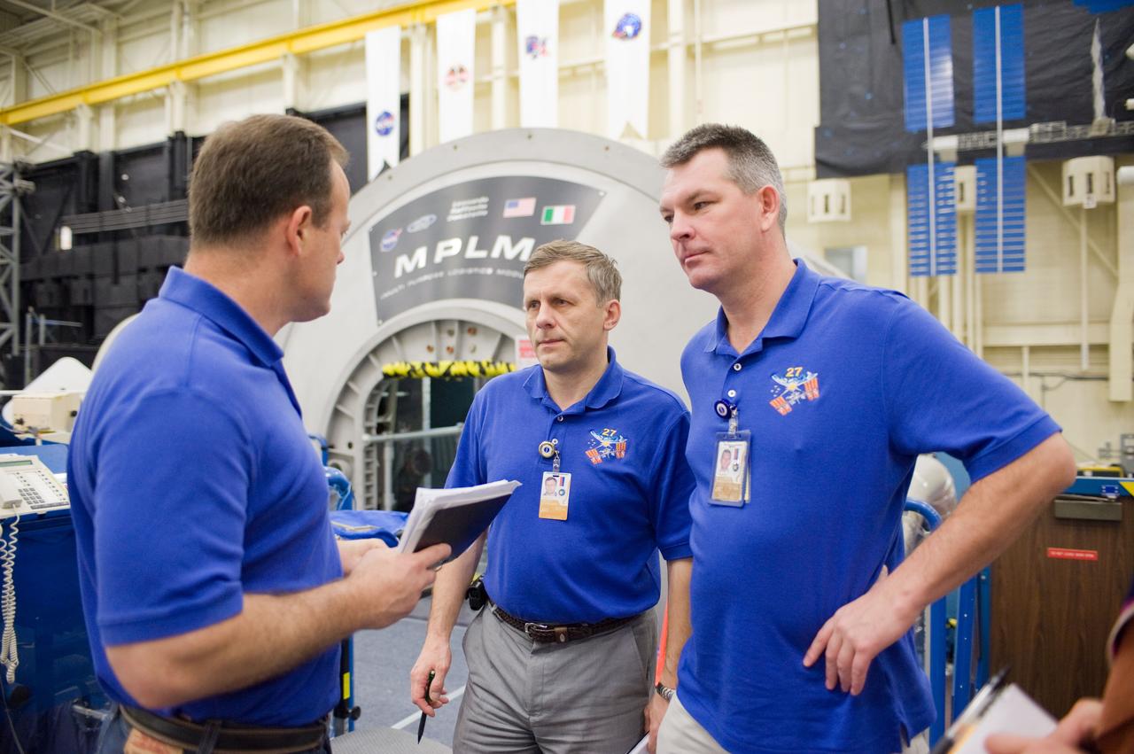 PHOTO DATE:  10-28-10 LOCATION:  Bldg 9NW, ISS Mockups SUBJECT:  Expedition 27 crew members Ron Garan, Andre Borisenko and Aleksandr Samokutyayev all working with instructors Nadine Lashier and Jennifer James during the crew's Routine Ops training PHOTOGRAPHER: James Blair 