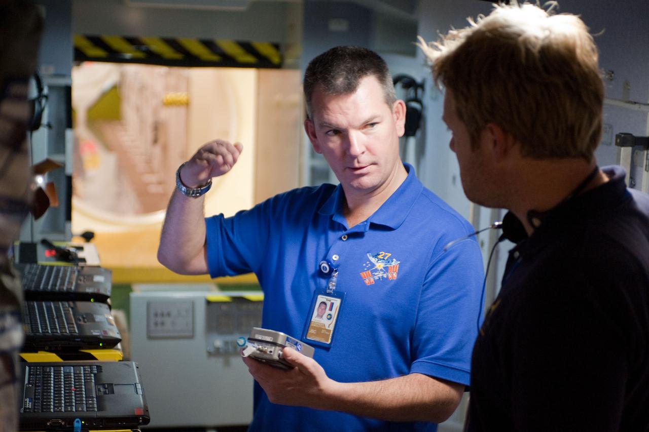 PHOTO DATE:  10-28-10 LOCATION:  Bldg 9NW, ISS Mockups SUBJECT:  Expedition 27 crew members Ron Garan, Andre Borisenko and Aleksandr Samokutyayev all working with instructors Nadine Lashier and Jennifer James during the crew's Routine Ops training PHOTOGRAPHER: James Blair 