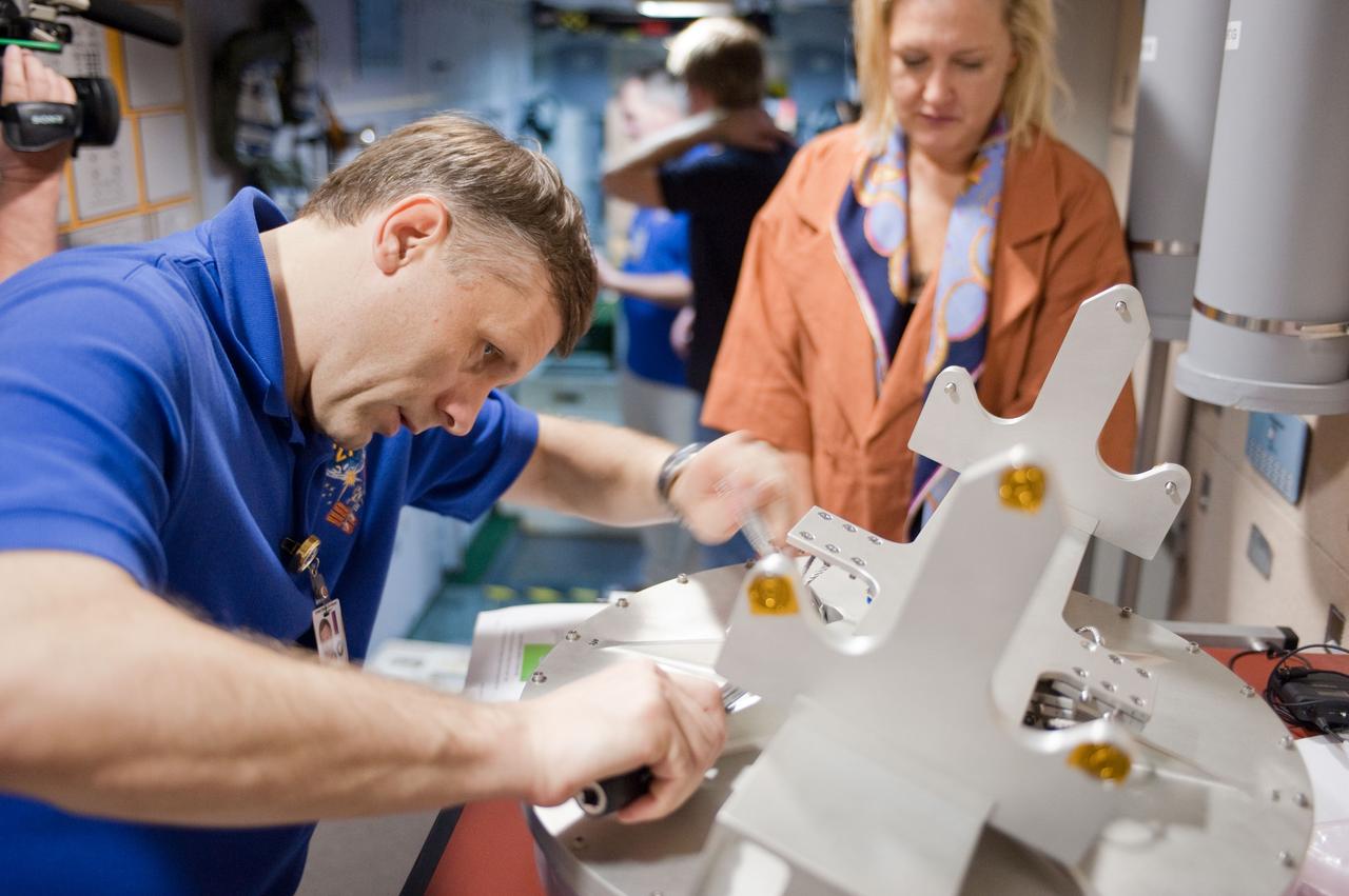 PHOTO DATE:  10-28-10 LOCATION:  Bldg 9NW, ISS Mockups SUBJECT:  Expedition 27 crew members Ron Garan, Andre Borisenko and Aleksandr Samokutyayev all working with instructors Nadine Lashier and Jennifer James during the crew's Routine Ops training PHOTOGRAPHER: James Blair 